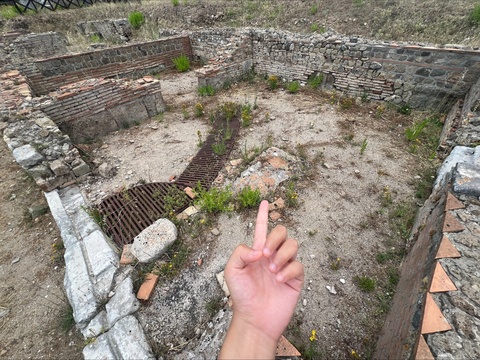 Yuwei Wei pointing out an ancient site from her summer research trip to Italy