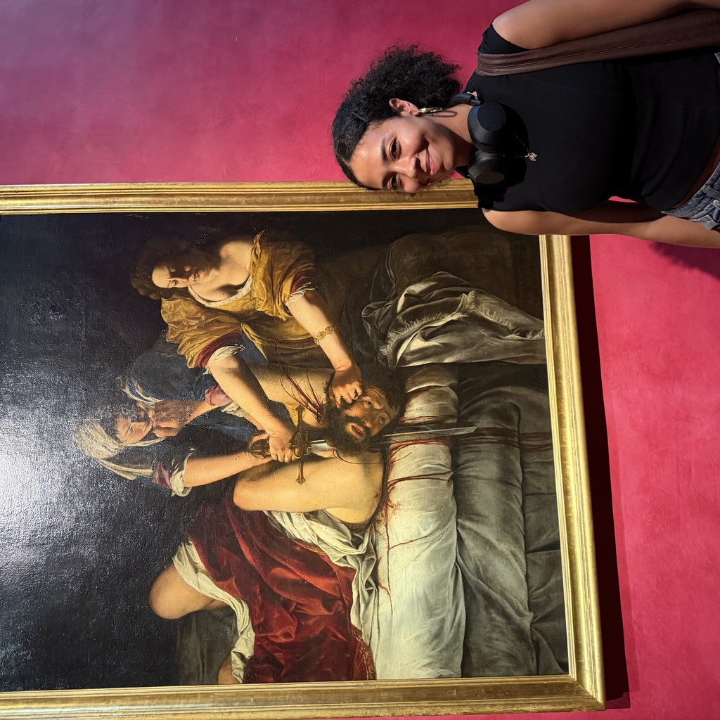 Tess Nalls standing in front of a painting