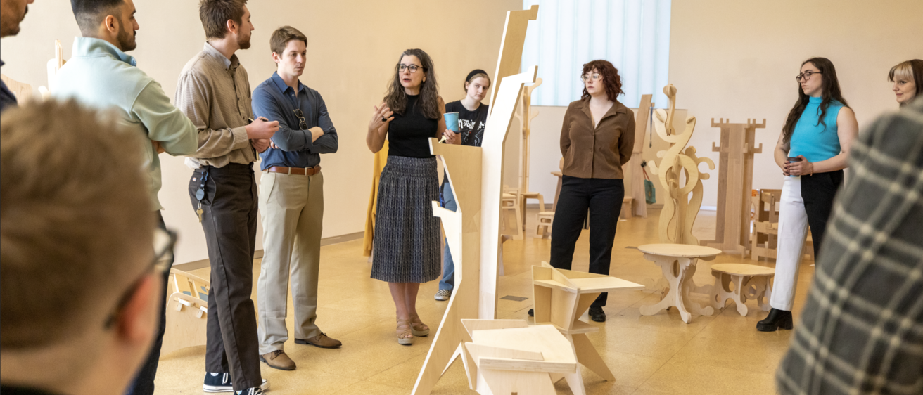 Monica Correia teaching 3D design in a gallery of work