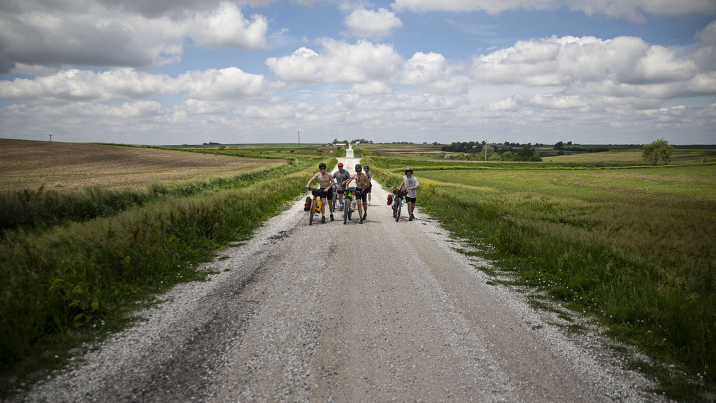 Steve McGuire and his students walking their bikes.