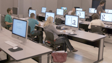 This is a picture of students in a graphic design classroom